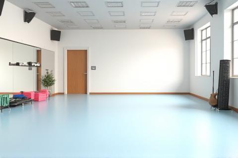 Group fitness studio with mats and equipment.